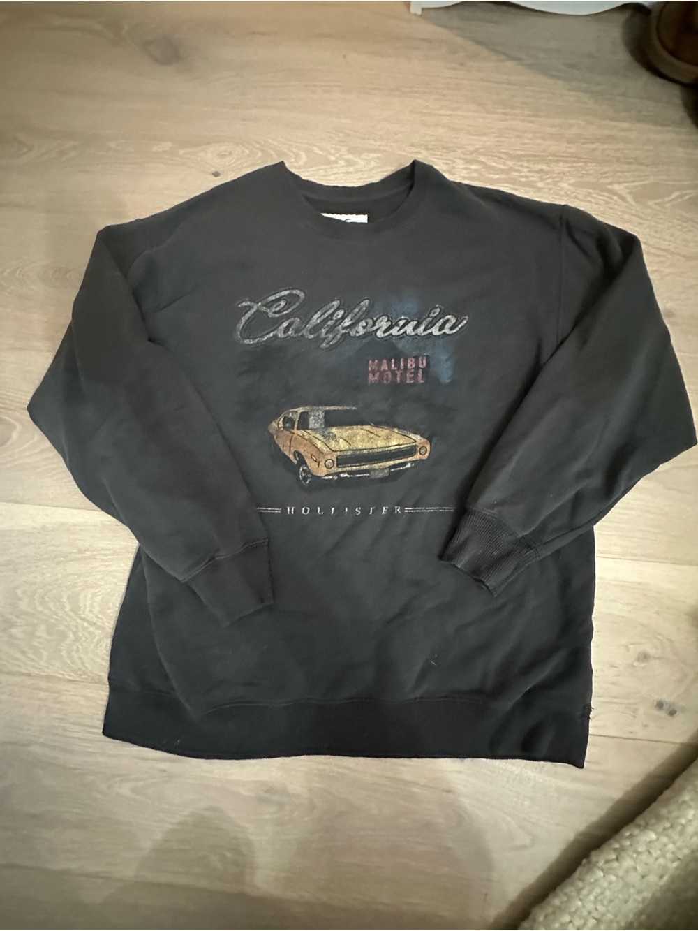 Hollister Black Crewneck Sweatshirt with Gold Car Graphic